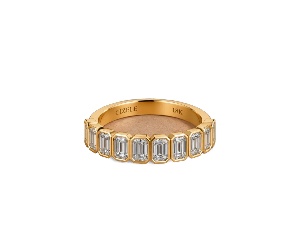 Baguette diamond wedding band in yellow gold, worn on the hand